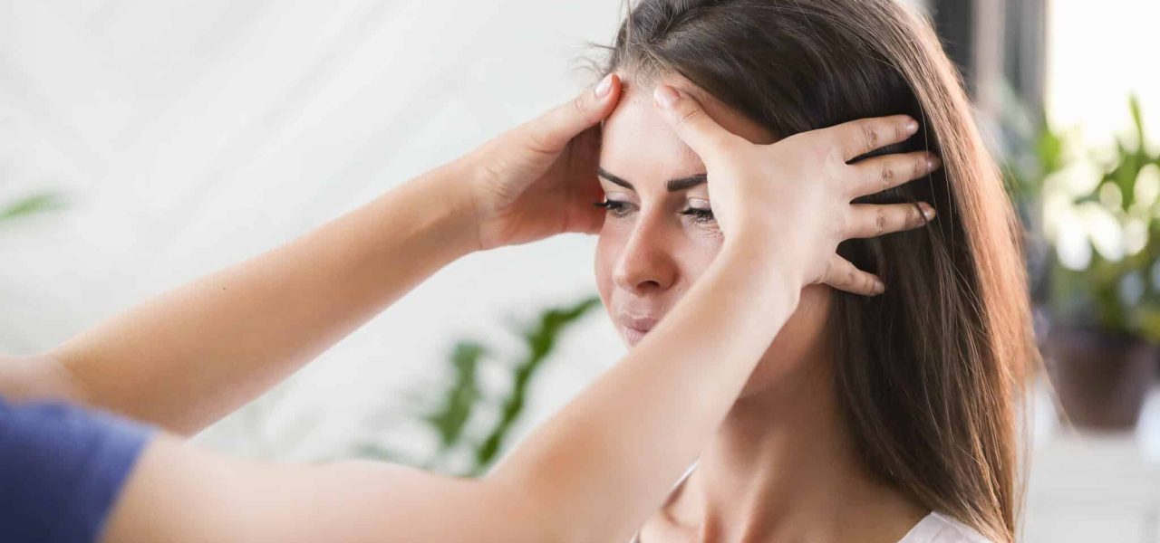 Woman is getting physical therapy from a professional doctor