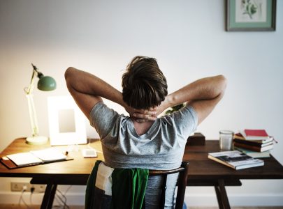 Man stressed while working on laptop